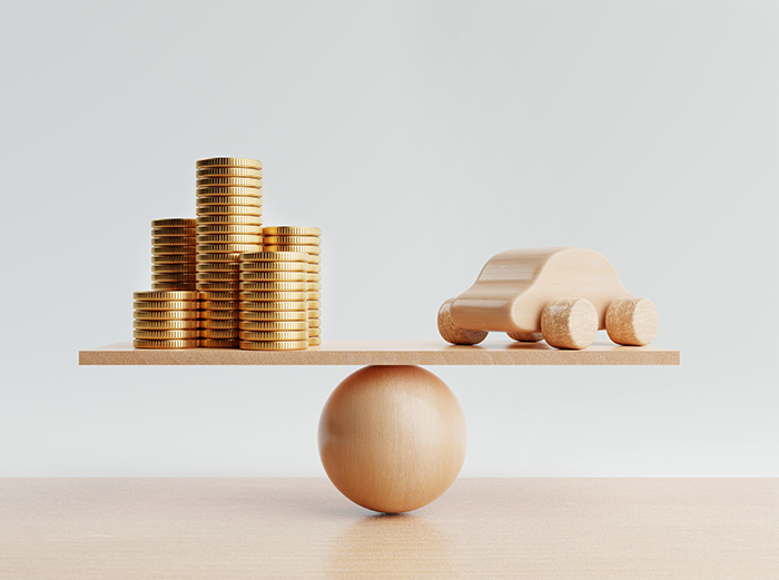 money and car wooden scales