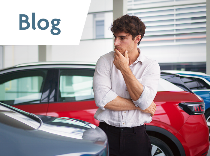 man thinking buying car